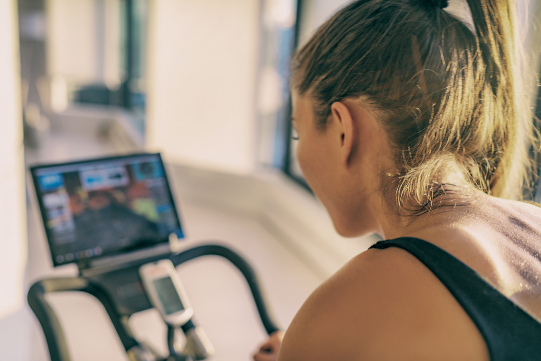 Woman using a Peloton.